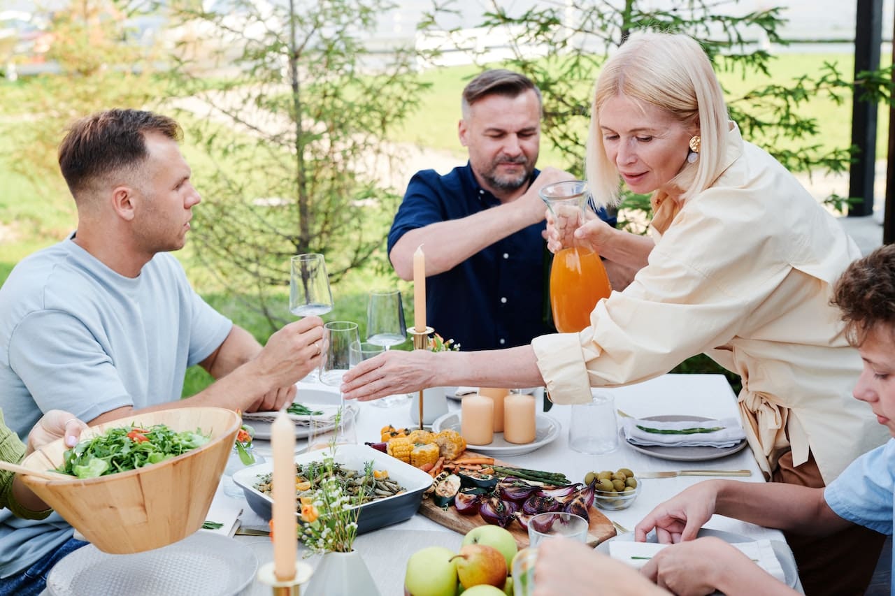 Family eating lunch in the backyard