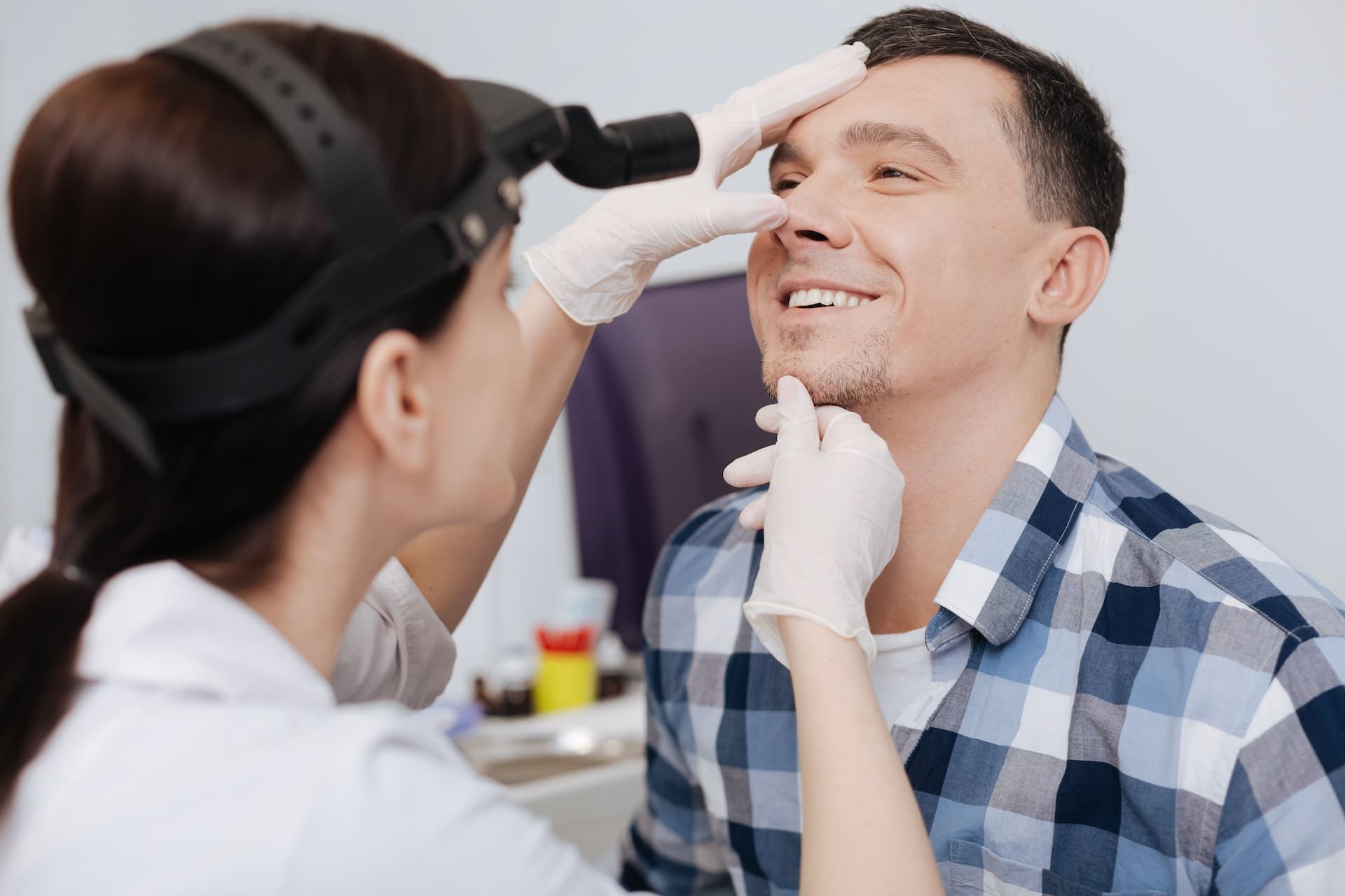 Dentist examining patient's teeth