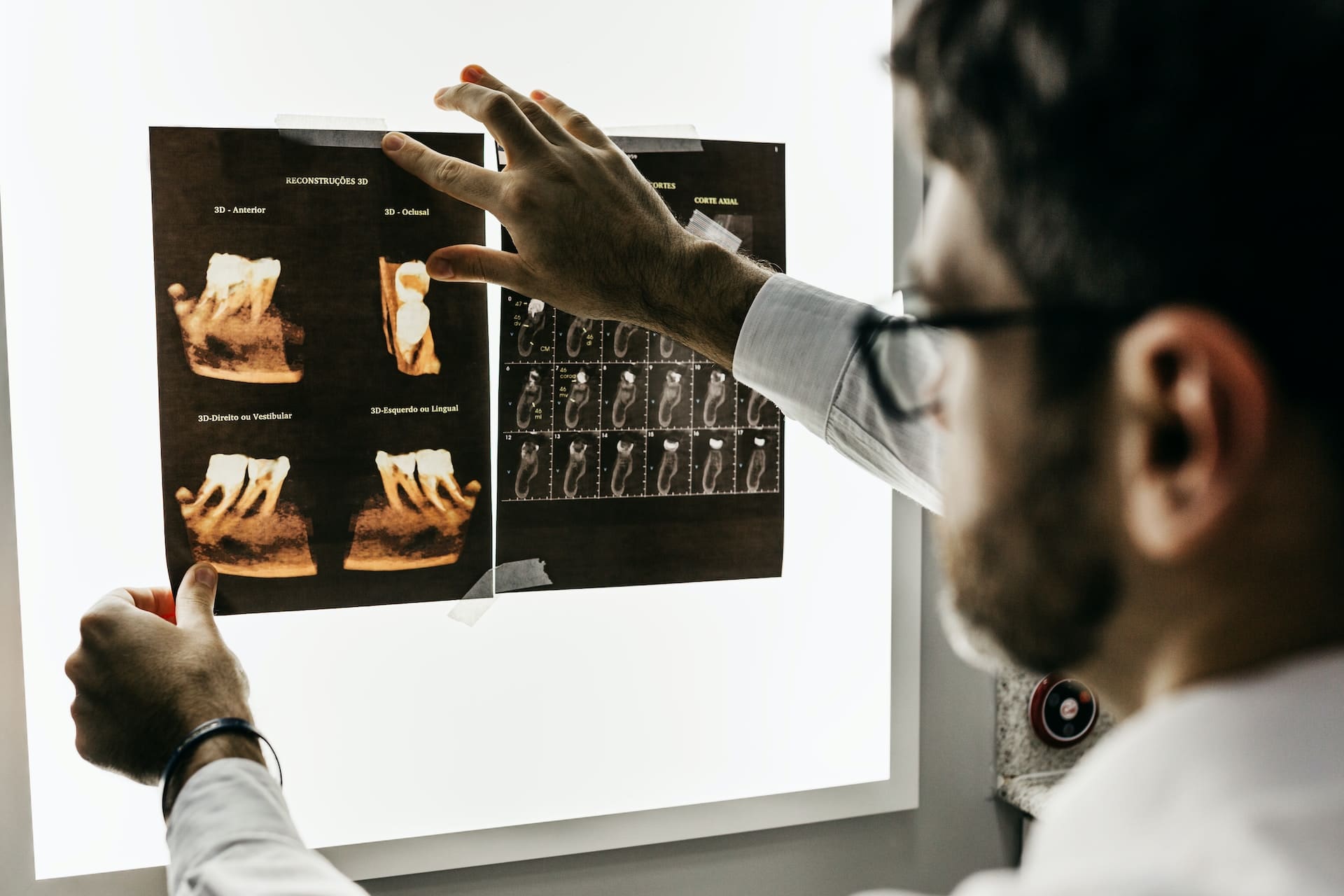 Patient reviewing dental X-ray with dentist