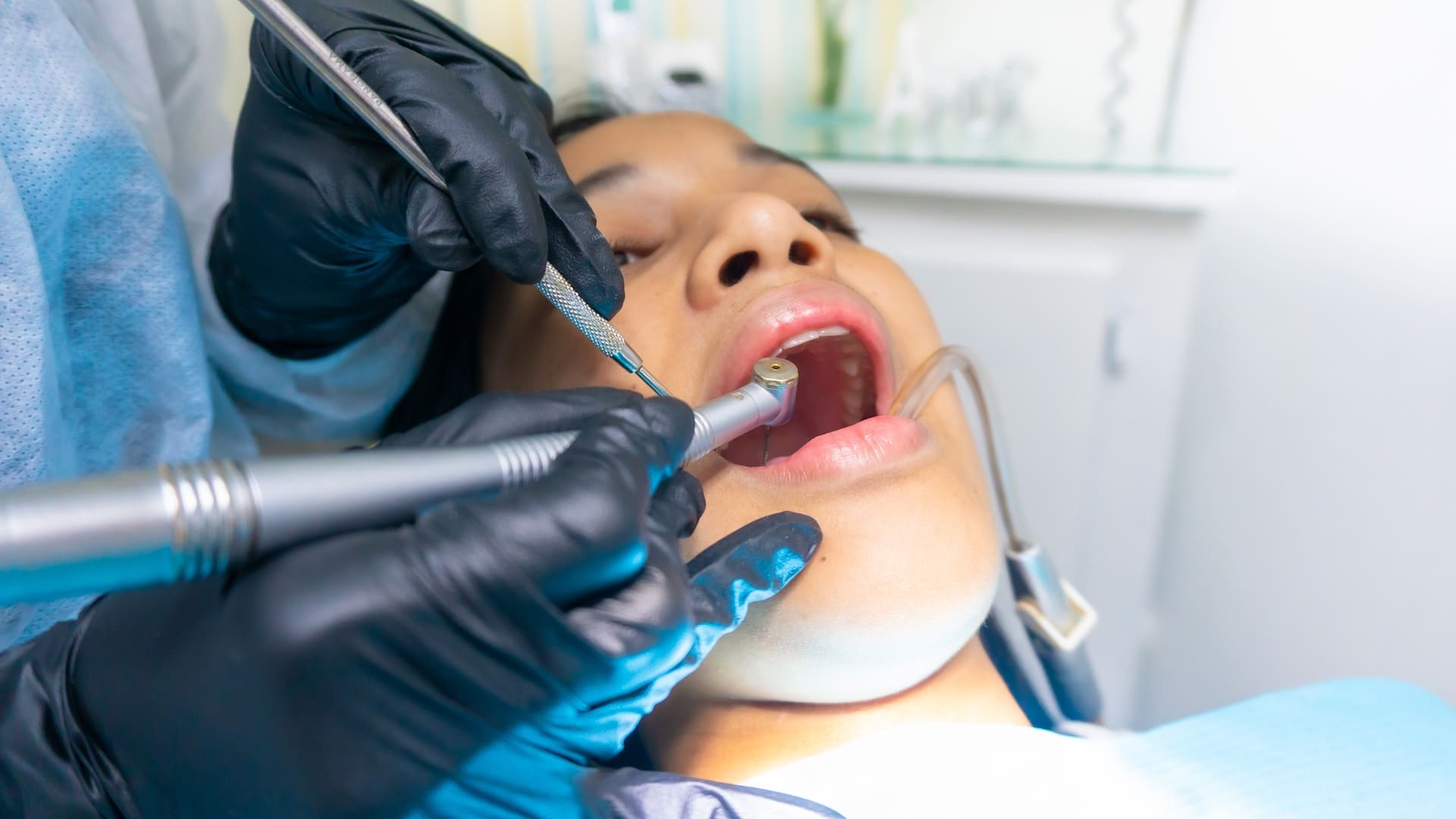 Patient receiving dental treatment in a dental clinic