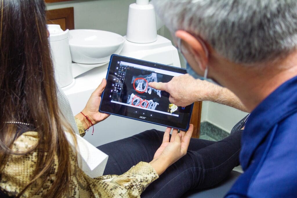 Doctor explaining emergency dental x-ray to patient