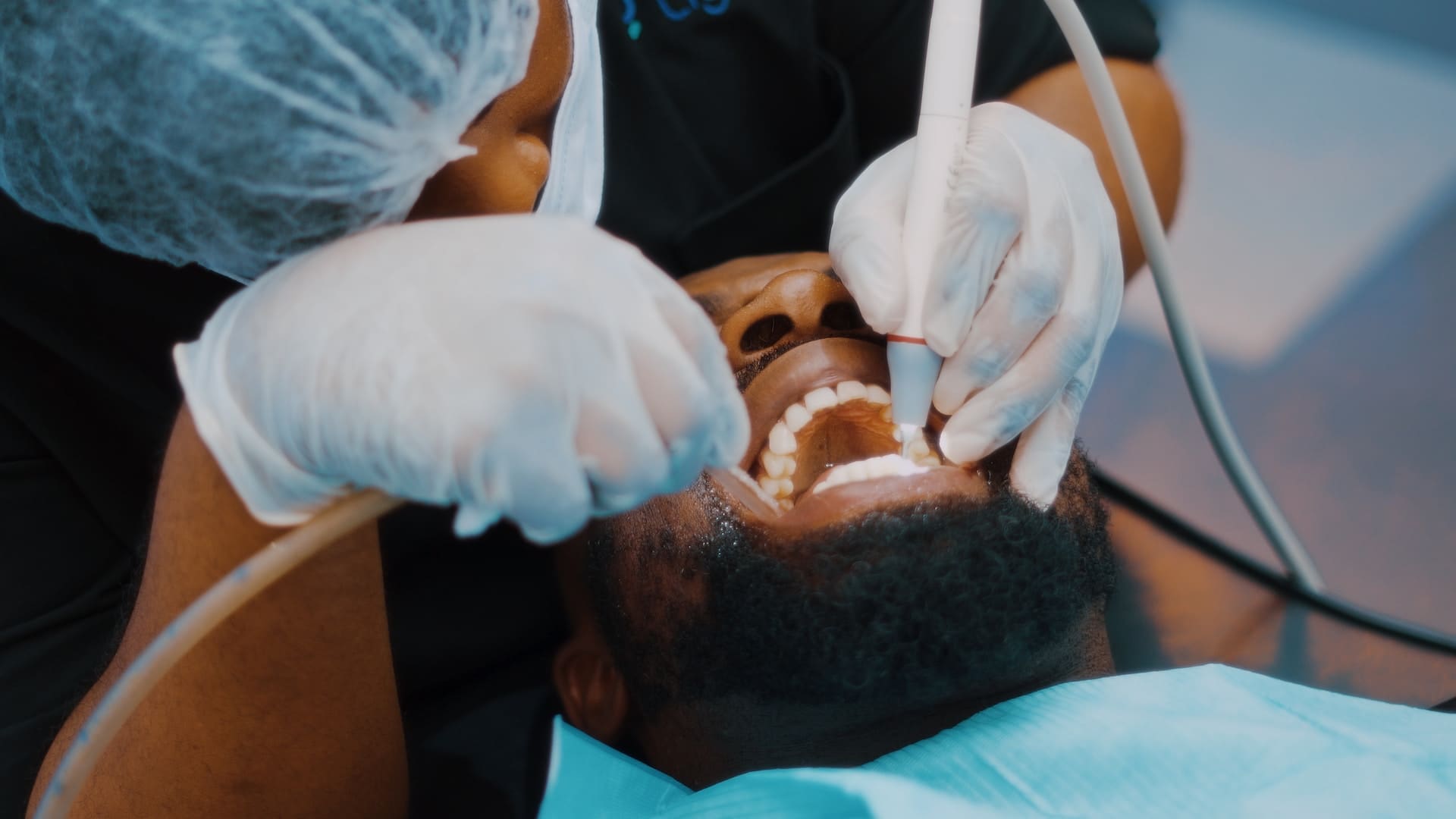 Patient receiving professional teeth whitening treatment