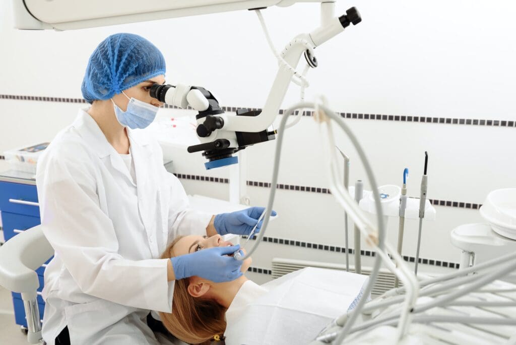 Dentist examining the mouth of a dental patient