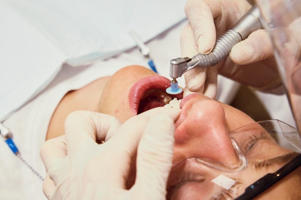 Male patient receiving cosmetic dental treatment.