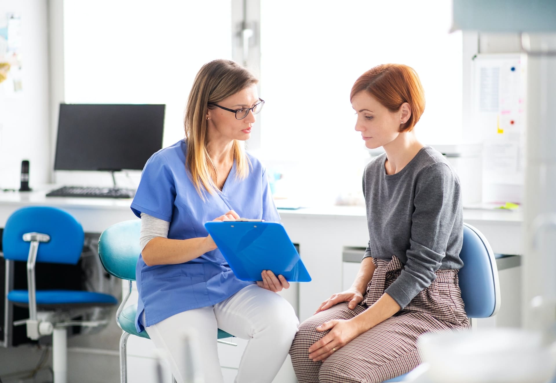 Dentist explaining CEREC crowns to a patient.