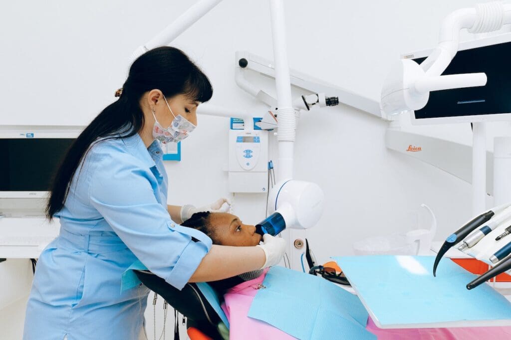 Patient undergoing Zoom teeth whitening treatment