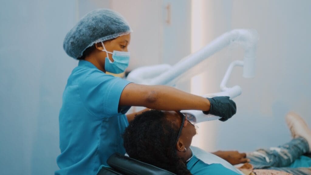 Patient undergoing Zoom teeth whitening treatment