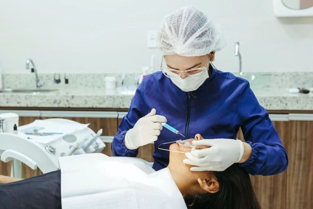 Girl receiving implant-supported dentures treatment