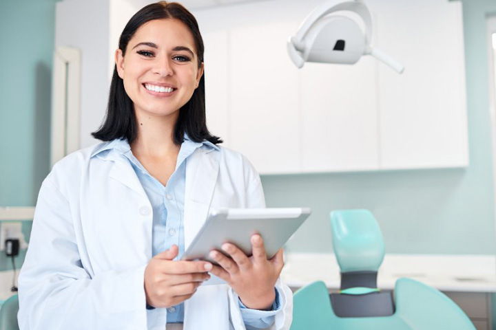 Dentist smiles.