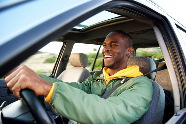 Man drives off happily.