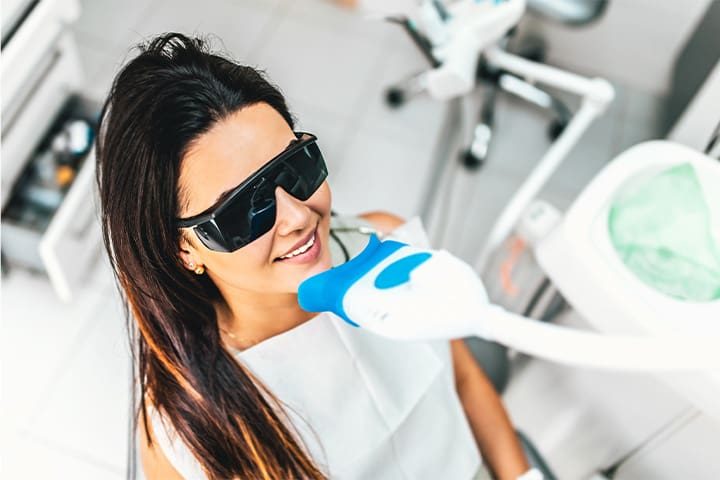 A patient receiving teeth whitening.