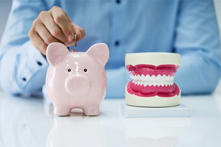 Patient in Danvers budgeting for dental implants